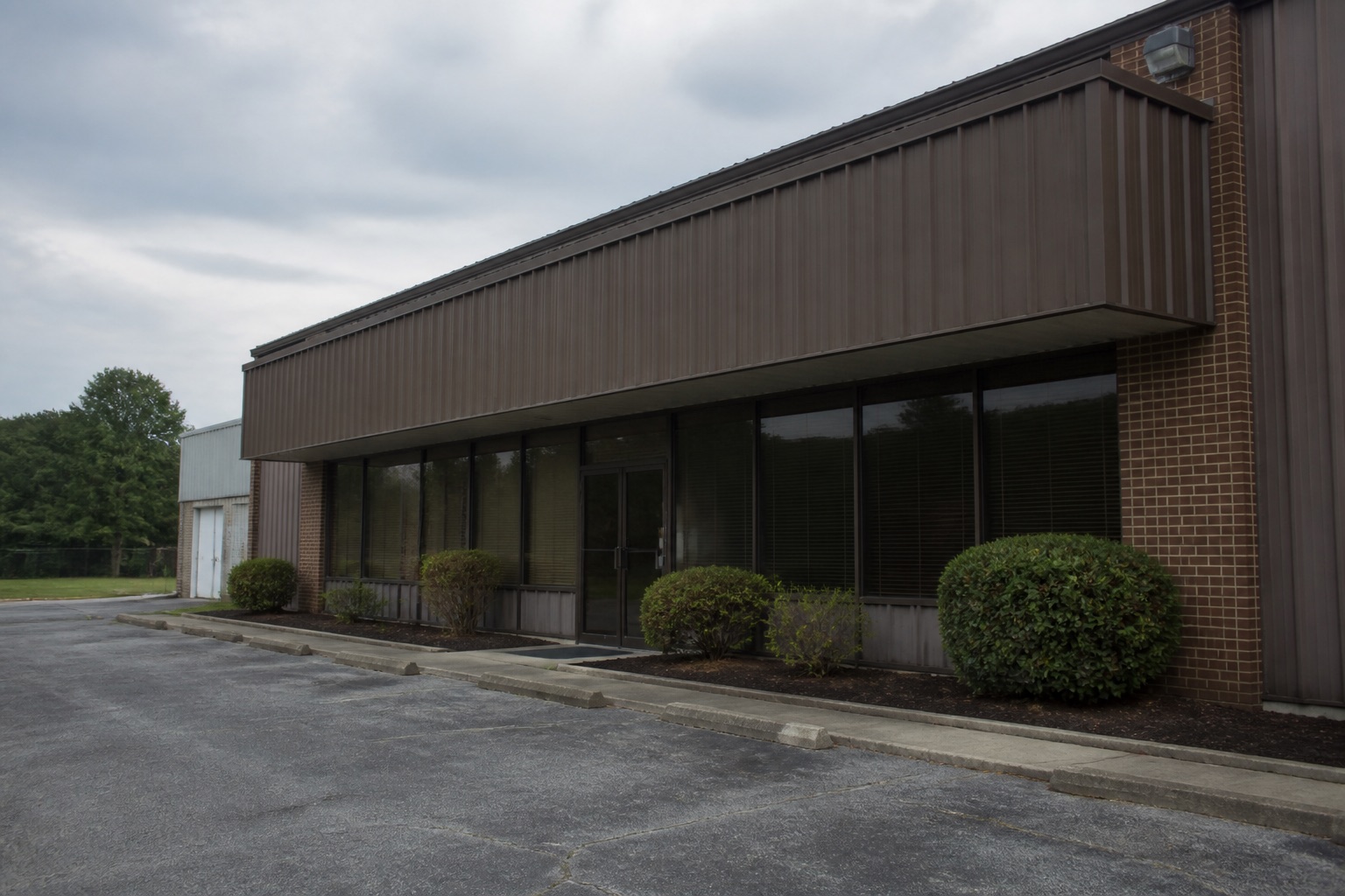 Vacant commercial building with a lock-box on the door